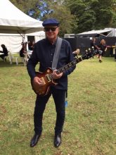 John Brewster of The Angels with the guitar made by his son Sam