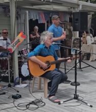 Neil Finn busking at Coatsville Market NZ