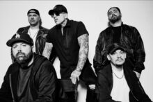 Bad Wolves band members pose together in promotional photo for Die About It (Deluxe).