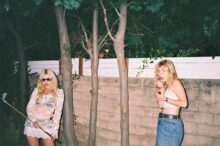 Lambrini Girls performing live on stage, Who Let the Dogs Out album cover by Lambrini Girls, Australian tour poster with Lambrini Girls dates