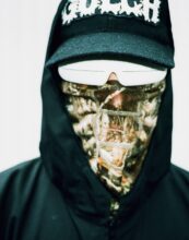 Promotional image of Portugal. The Man by Maclay Heriot, showing the band members against a vibrant backdrop