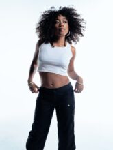 UMI, Seattle-born R&B singer-songwriter, photographed by Eric Nguyen, announcing her 2026 People Stories World Tour across Australia and New Zealand.