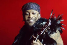 D’Angelo performing onstage, late 1990s, soulful spotlight