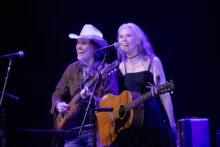 Gillian Welch and David Rawlings performing live with acoustic guitars during their Australian tour