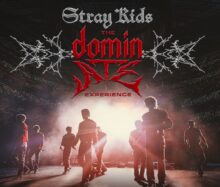 Stray Kids performing live on stage during The DominATE Experience concert film