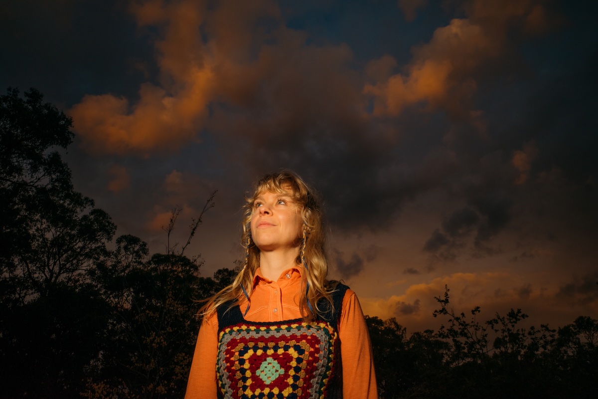 Leah Senior performing with acoustic guitar promoting new album Pt. Roadknight