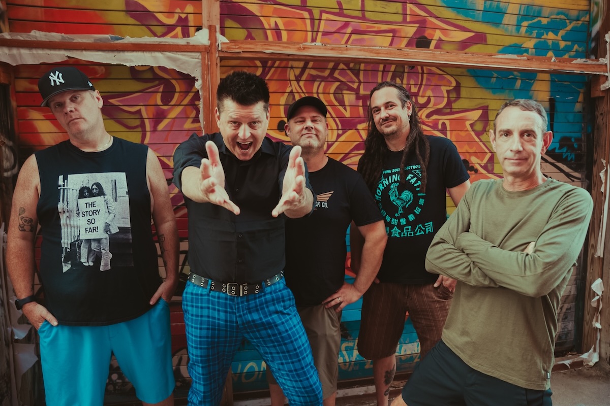Less Than Jake performing live with brass section during ska-punk concert