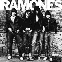 Ramones 1976 debut album cover black and white photo of band against brick wall