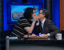 Jack White and Stephen Colbert "lady and the tramping" a hotdog on Only In Monroe 2026