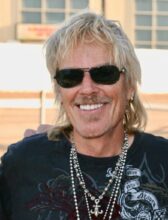 Frank Beard, drummer and founding member of ZZ Top, performing with the band
