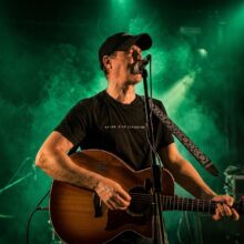 Gary Óg performing live on acoustic guitar