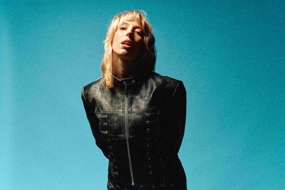 Lotte Gallagher performing in a black outfit for the release of Wish