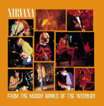 Kurt Cobain performing live with Nirvana on stage playing a fender guitar