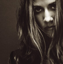 Sheryl Crow performing during the era of her 1996 self-titled album
