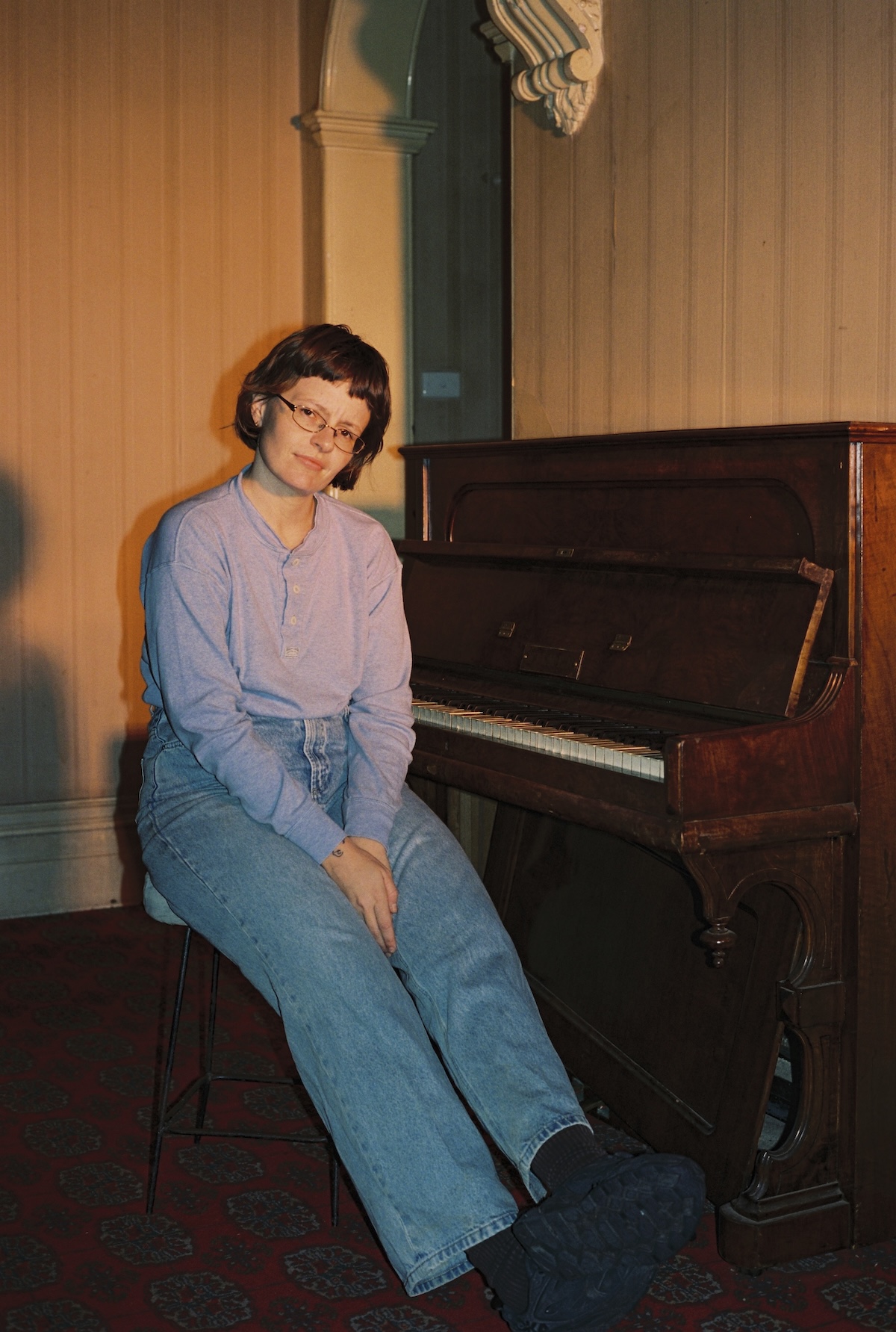 Ruby Gill holding guitar for fishing is not about fishing album campaign
